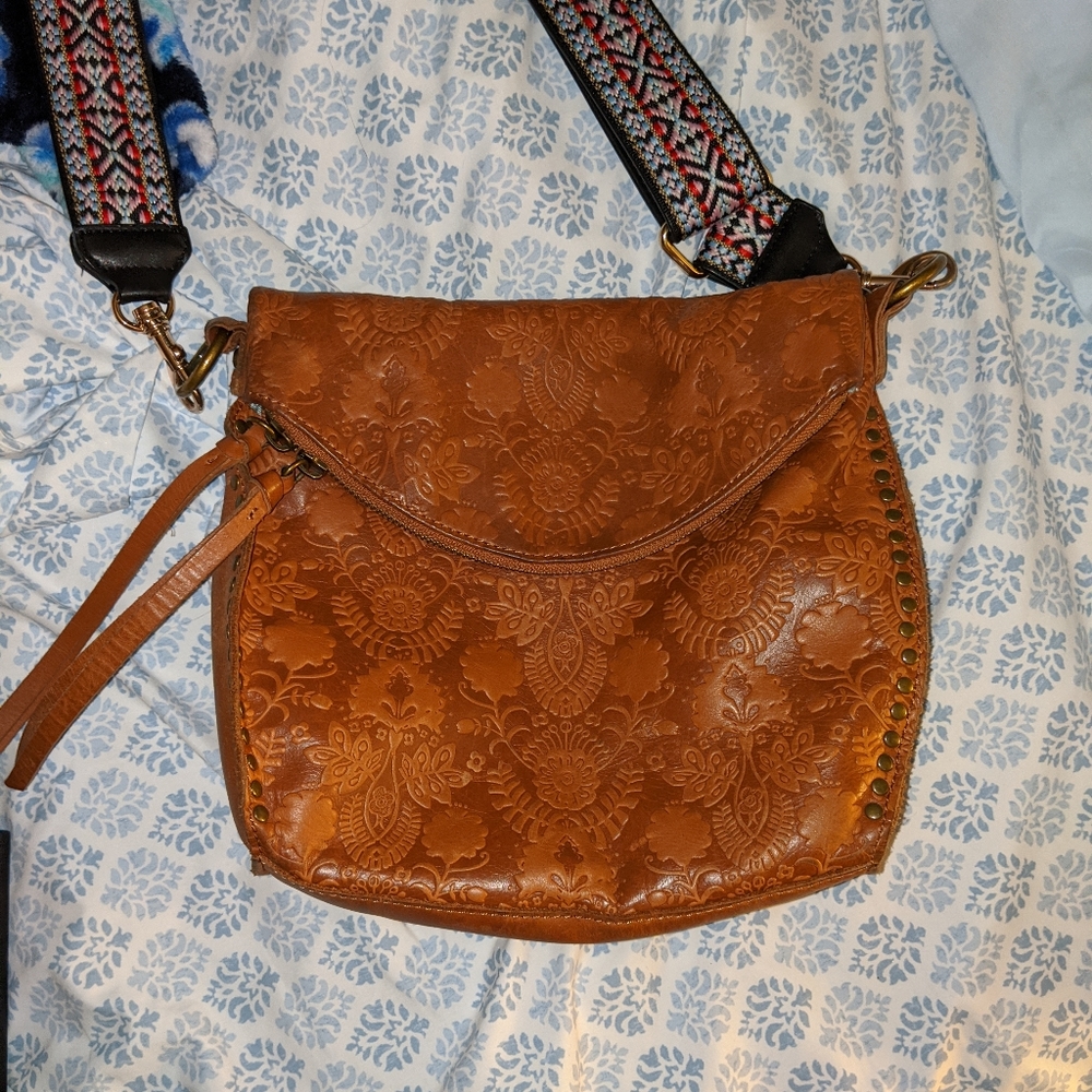 Sak purse with colorful guitar style strap
